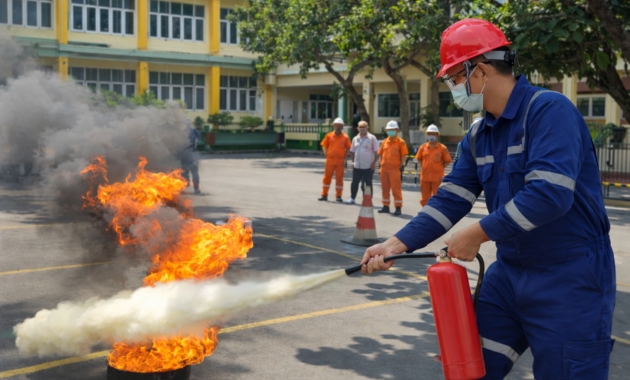 Fire safety training and emergency response drill using extinguishers and safety procedures